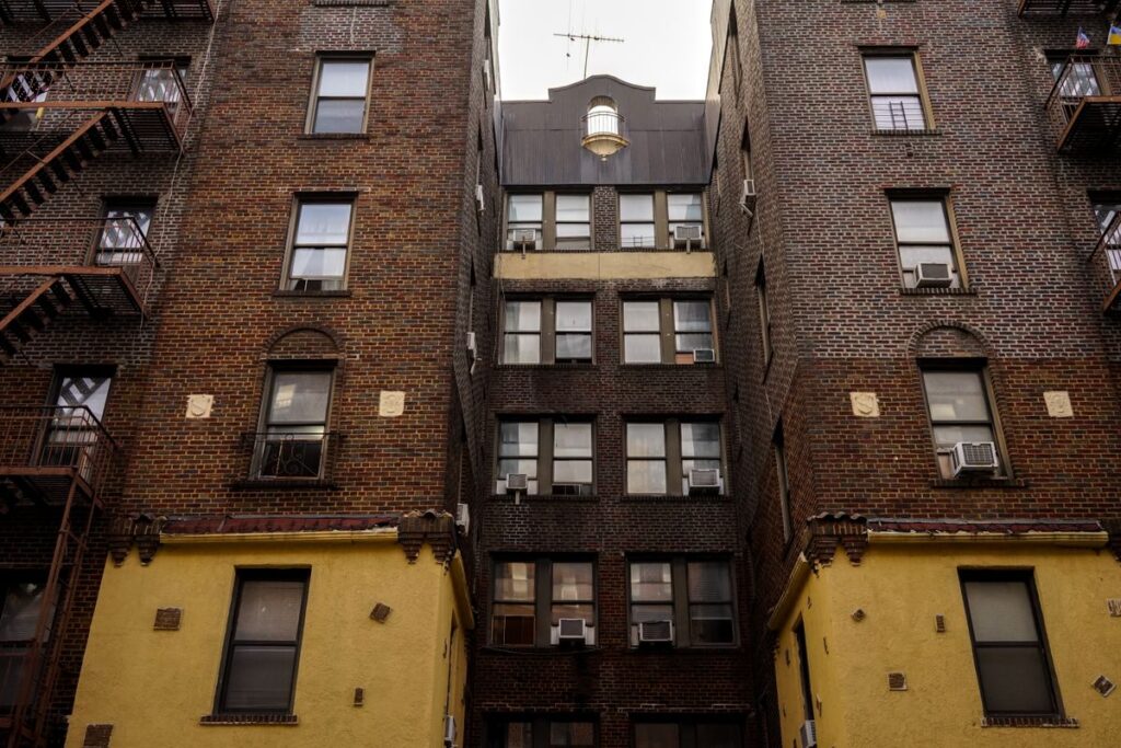 Brick apartment buildings with fire escapes in New York City